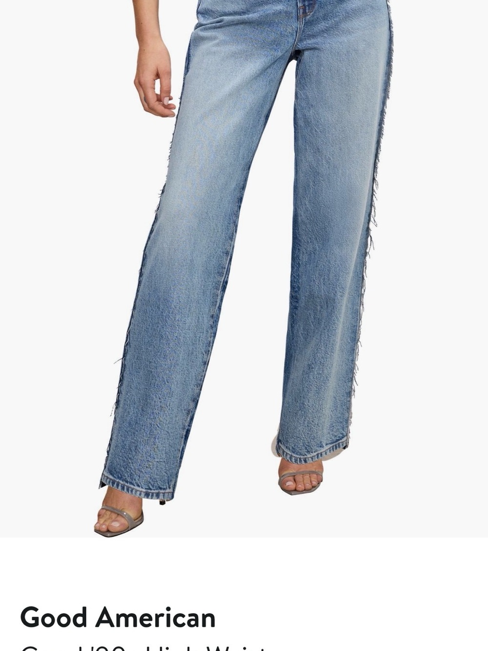 Good American Light Blue High-Rise Wide Leg Jeans with Frayed Side Seams.
